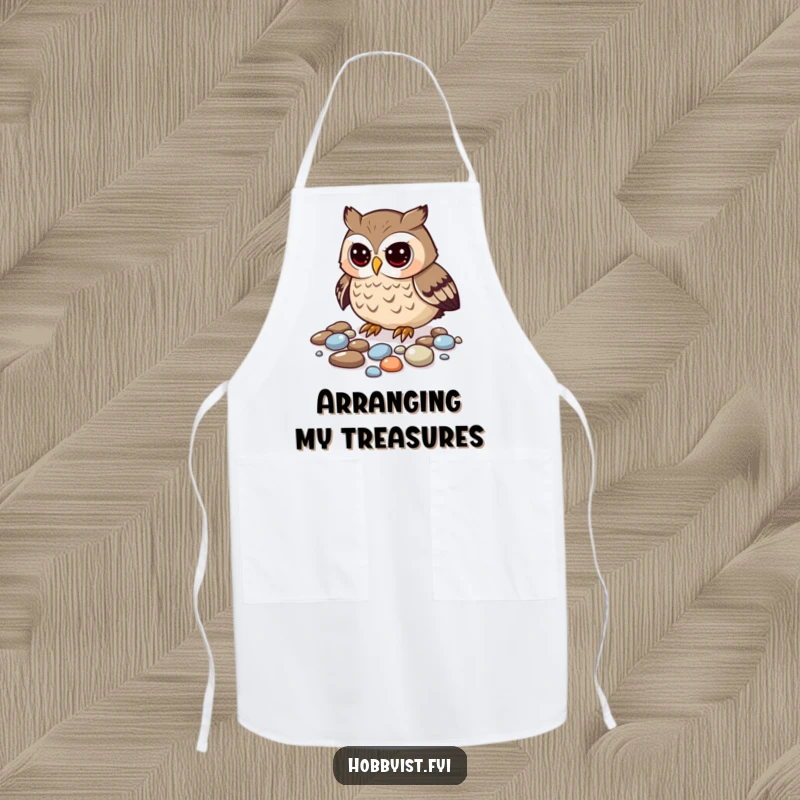 Funny owl apron depicting a curious owl meticulously arranging shiny pebbles, a collector's best friend.