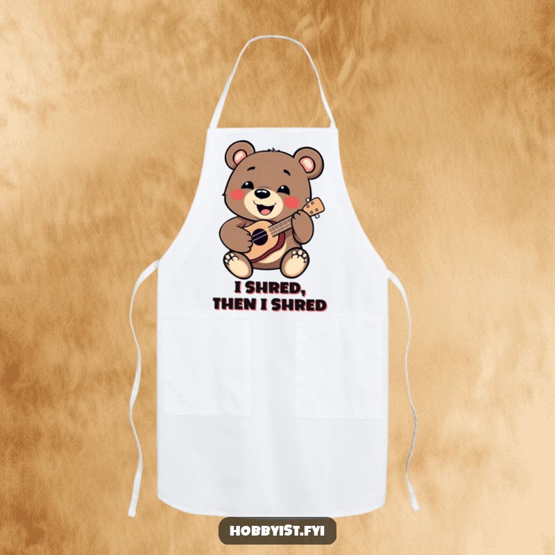 Funny Bear Apron: A smiling bear enthusiastically plays a miniature ukulele while cooking, adding musical fun to the kitchen, a funny gift.