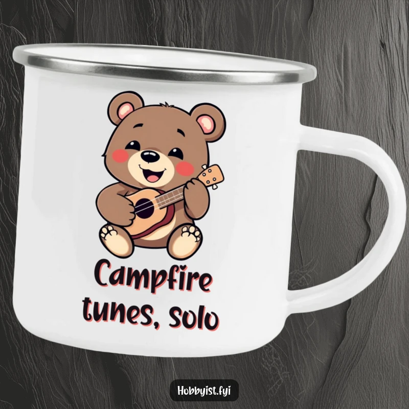 Funny Bear Camping Mug: A smiling bear enthusiastically plays a miniature ukulele around a campfire, perfect for outdoor adventures, a funny gift.