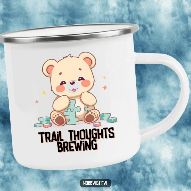 Funny bear cub character happily focused on assembling a difficult puzzle, depicted on a durable camping mug for outdoor fun.