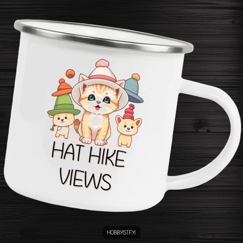 Funny camping mug with a curious kitten trying on oversized hats, perfect for outdoor enjoyment and humorous feline fashion.