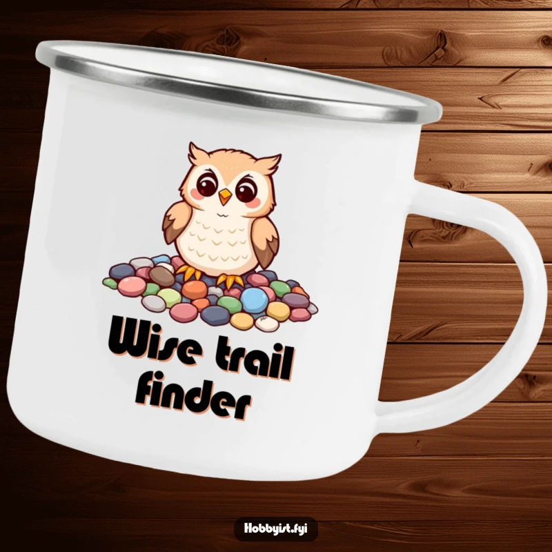 Funny camping mug with a cheerful owl carefully arranging colorful pebbles into a mosaic, perfect for outdoor enjoyment and artistic humor.