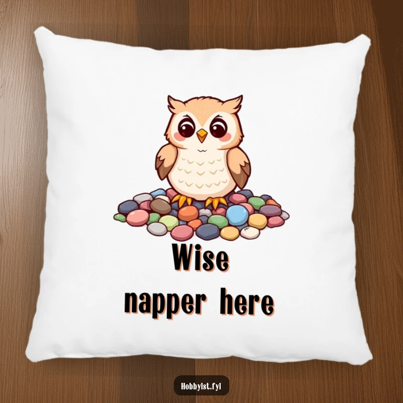 Funny pillow with a cheerful owl carefully arranging colorful pebbles into a mosaic, offering soft comfort and artistic humor.