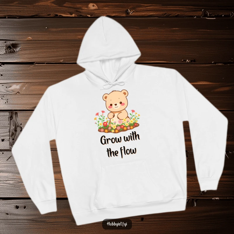 Funny Kawaii bear hoodie, depicting a happy bear tending a miniature garden overflowing with vibrant blooms, perfect for cozy wear.