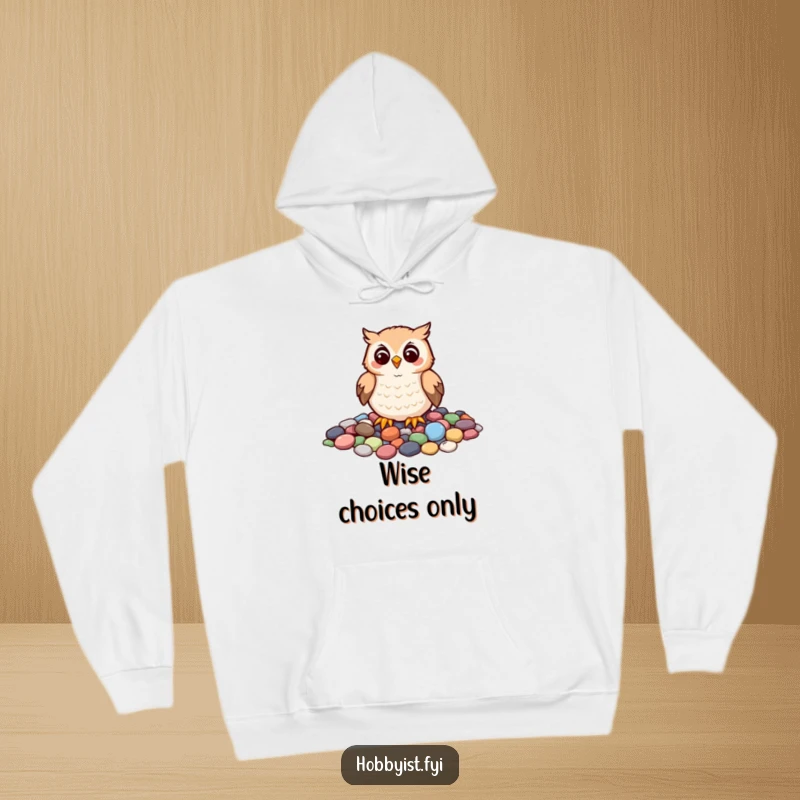 Funny hoodie featuring a cheerful owl carefully arranging colorful pebbles to create a mosaic, perfect for cozy and artistic wear.