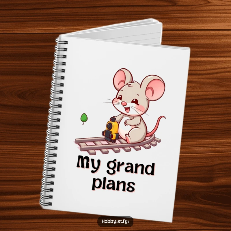 Funny cheerful mouse character playing intently with miniature train tracks and a train on the cover of this creative notebook.