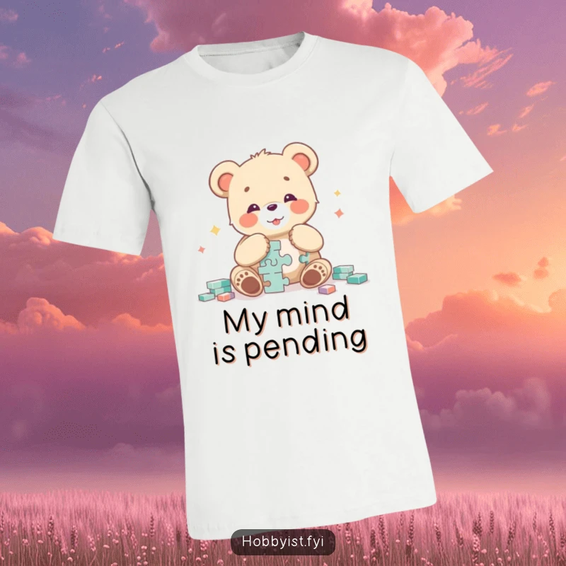 Funny curious bear cub character intensely focused on assembling a complex jigsaw puzzle with a cheerful, gleeful expression on this t-shirt.