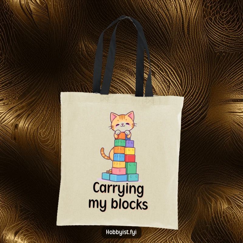 Funny Cat Blocks Tower Tote Bag: A playful cat building a tower of colorful blocks, designed for a functional and humorous carry.