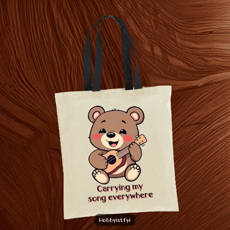 Funny Bear Tote Bag: A smiling bear enthusiastically plays a miniature ukulele, perfect for carrying groceries or music gear with a funny twist.