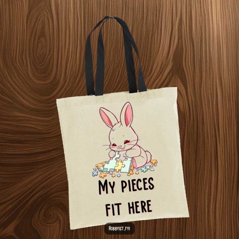 Funny Rabbit Puzzle Master Tote Bag: A delighted rabbit meticulously assembles a complex puzzle with intense focus, perfect for carrying puzzle pieces humorously.