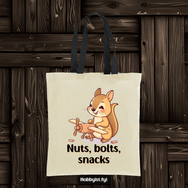 Funny Tote Bag featuring a happy squirrel meticulously assembling a small wooden model airplane, perfect for carrying hobby supplies.