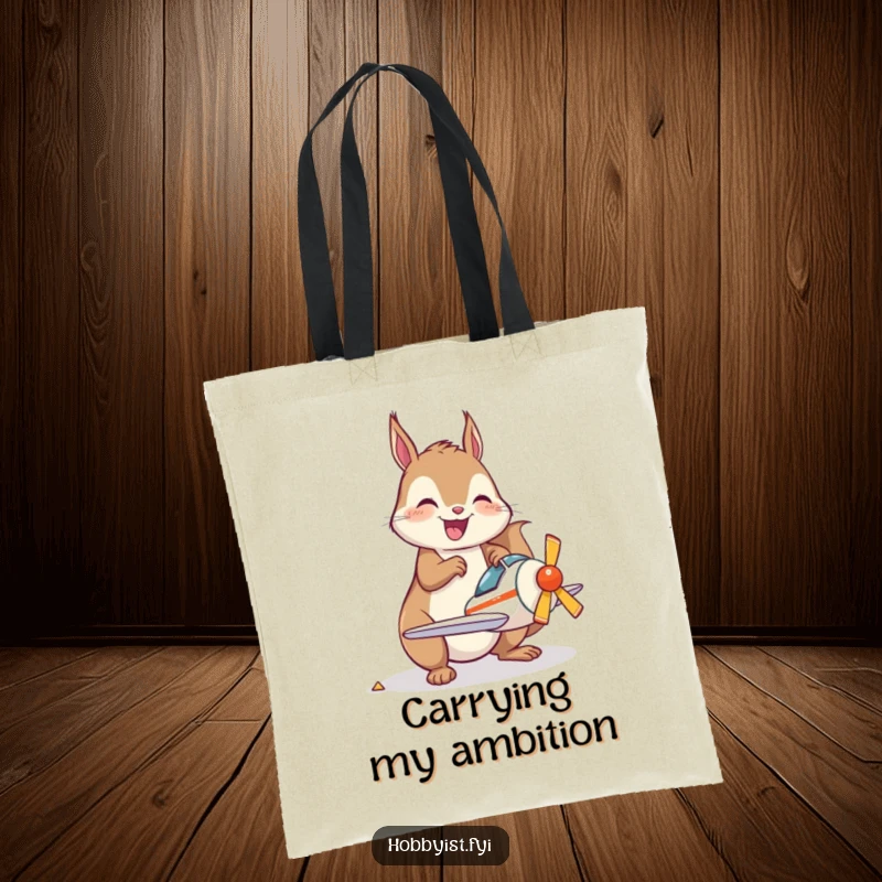 Funny Tote Bag showcasing a joyful kawaii squirrel happily assembling a miniature model airplane, ideal for carrying hobby supplies.